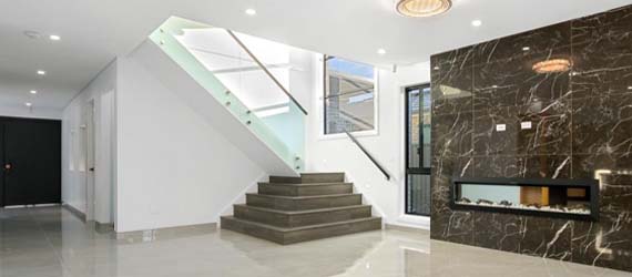 Sculptural marble staircase in a double-storey home